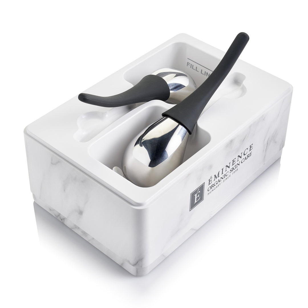 Eminence Organics Cryo-Thermal Sculpting Tool in use with box on white back ground
