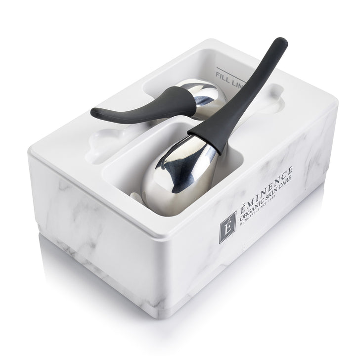 Eminence Organics Cryo-Thermal Sculpting Tool in use with box on white back ground