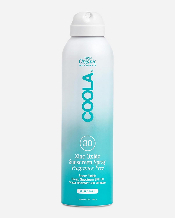 A tall aerosol can of COOLA Mineral Body Organic Sunscreen Spray SPF 30 Fragrance Free with a white-to-turquoise gradient label, shown on a light gray background.