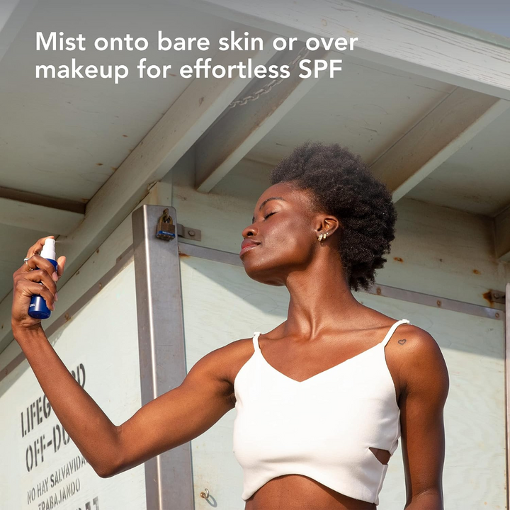 COOLA Refreshing Water Mist Organic Face Sunscreen SPF 18 application