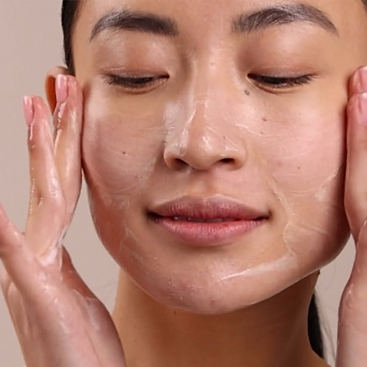 Eminence Organics Clear Skin Starter Set model using clear skin cleanser