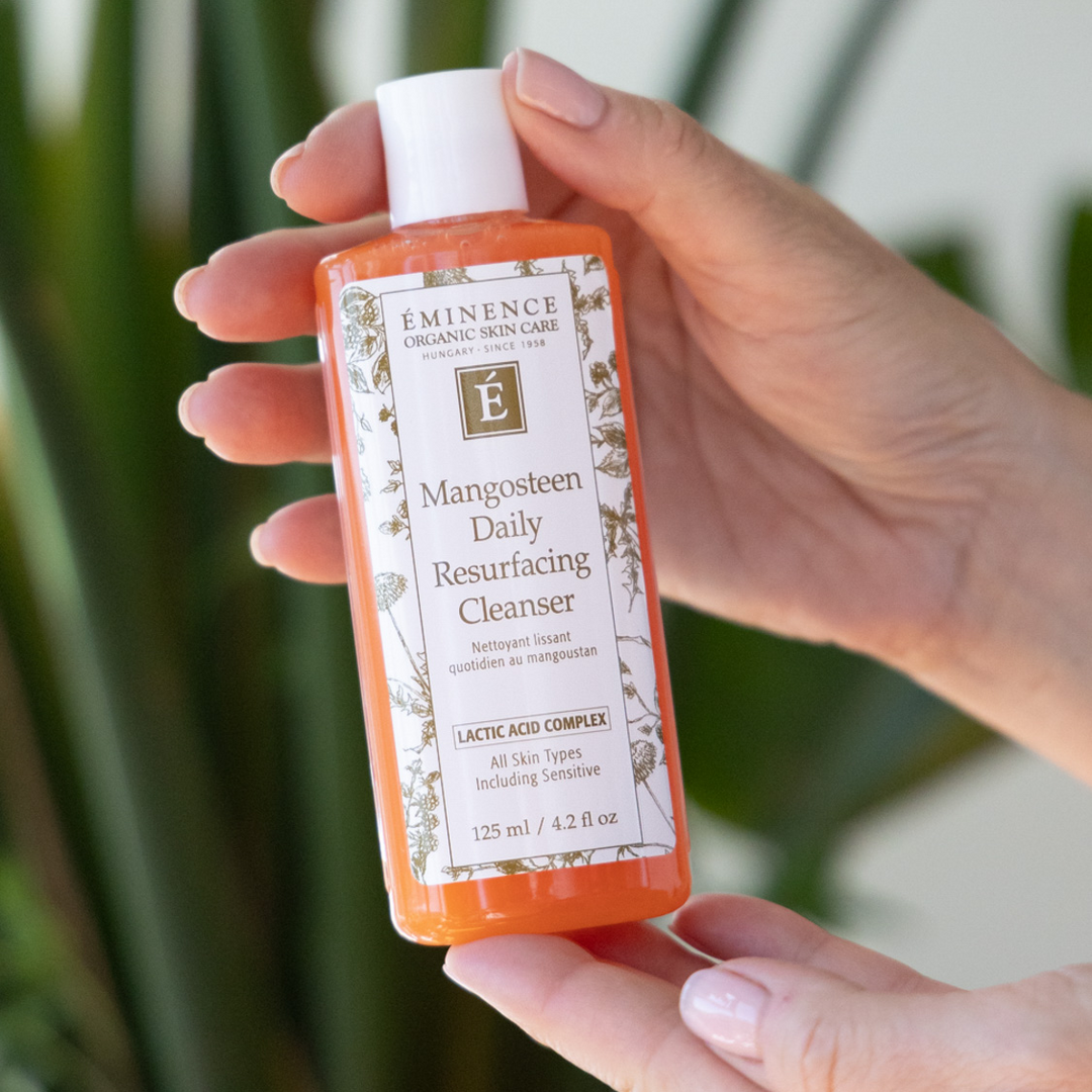Eminence Organics Mangosteen Daily Resurfacing Cleanser hand holding