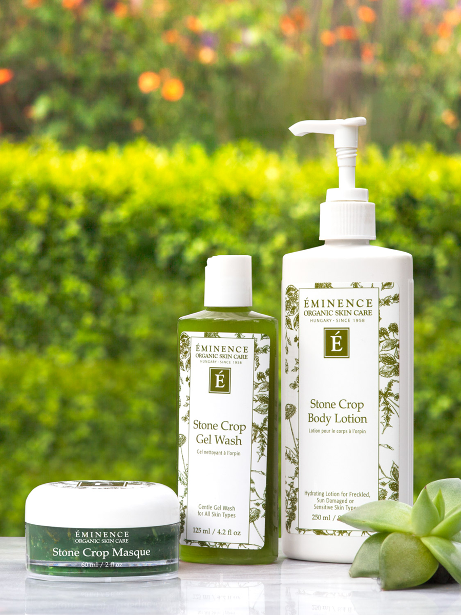 Eminence Organics skincare products with a garden background