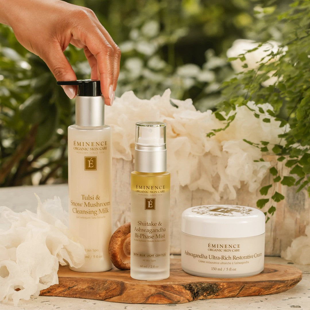 Eminence Organics Tulsi & Snow Mushroom Cleansing Milk with new collection products and a model picking up the cleanser