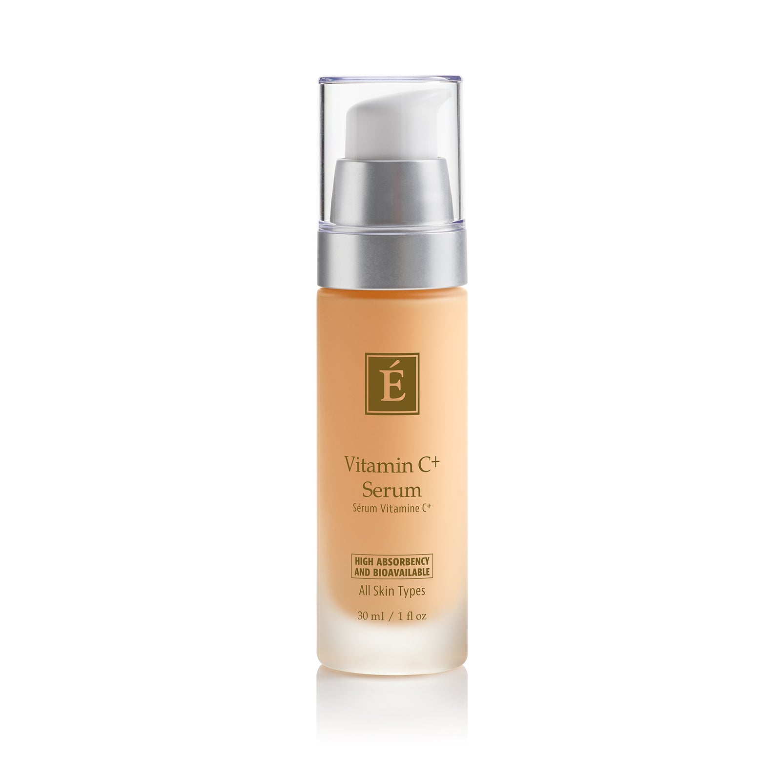 A 30 ml pump bottle ofEminence Organics Vitamin C+ Serum featuring a light peach-colored body, a silver pump collar, and a clear cap, set against a plain white background with a soft reflection.