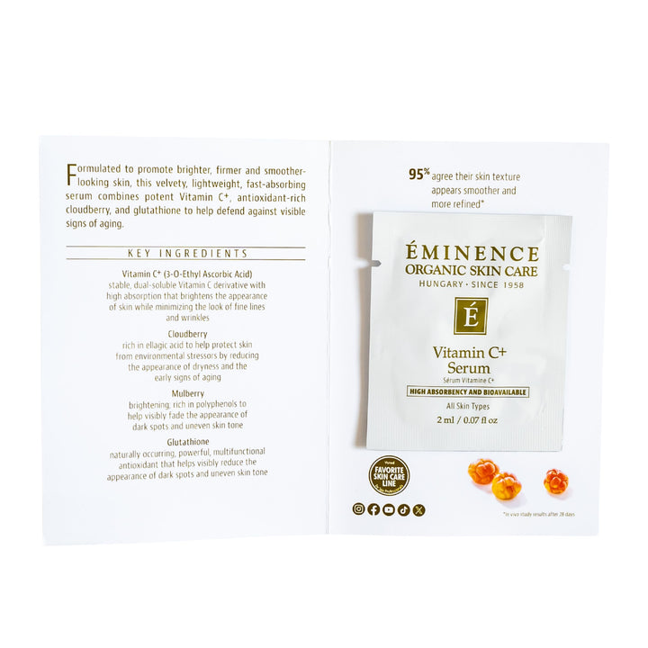 An open sample of Eminence Organics Vitamin C+ Serum showing the front and back printed panels on a white background.