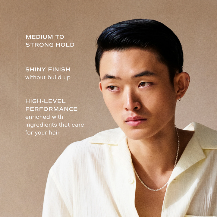 Man with styled hair against a beige background with INNERSENSE Organic Beauty Inner Reflection Sculpting Pomade features text.