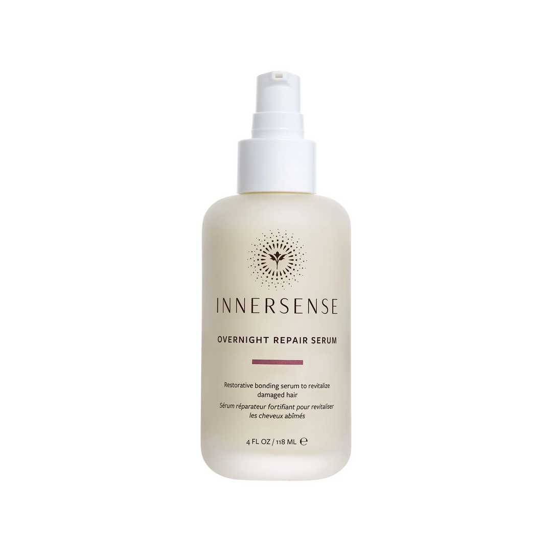 A bottle of INNERSENSE Organic Beauty - Overnight Repair Serum with a white pump dispenser and a frosted off-white bottle, shown against a plain white background.