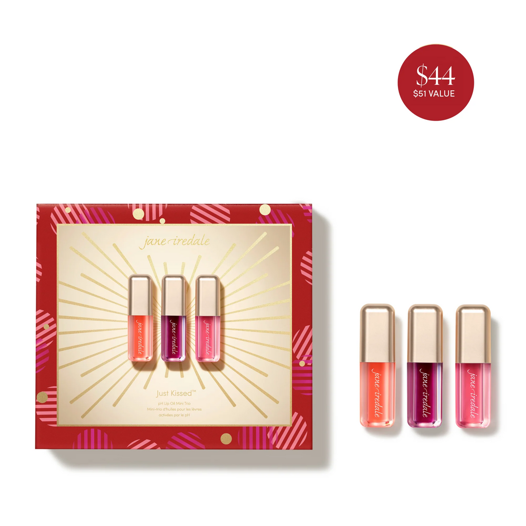 Jane Iredale Just Kissed pH Lip Oil Mini Trio with three gold-capped lip oils beside a red and gold gift box