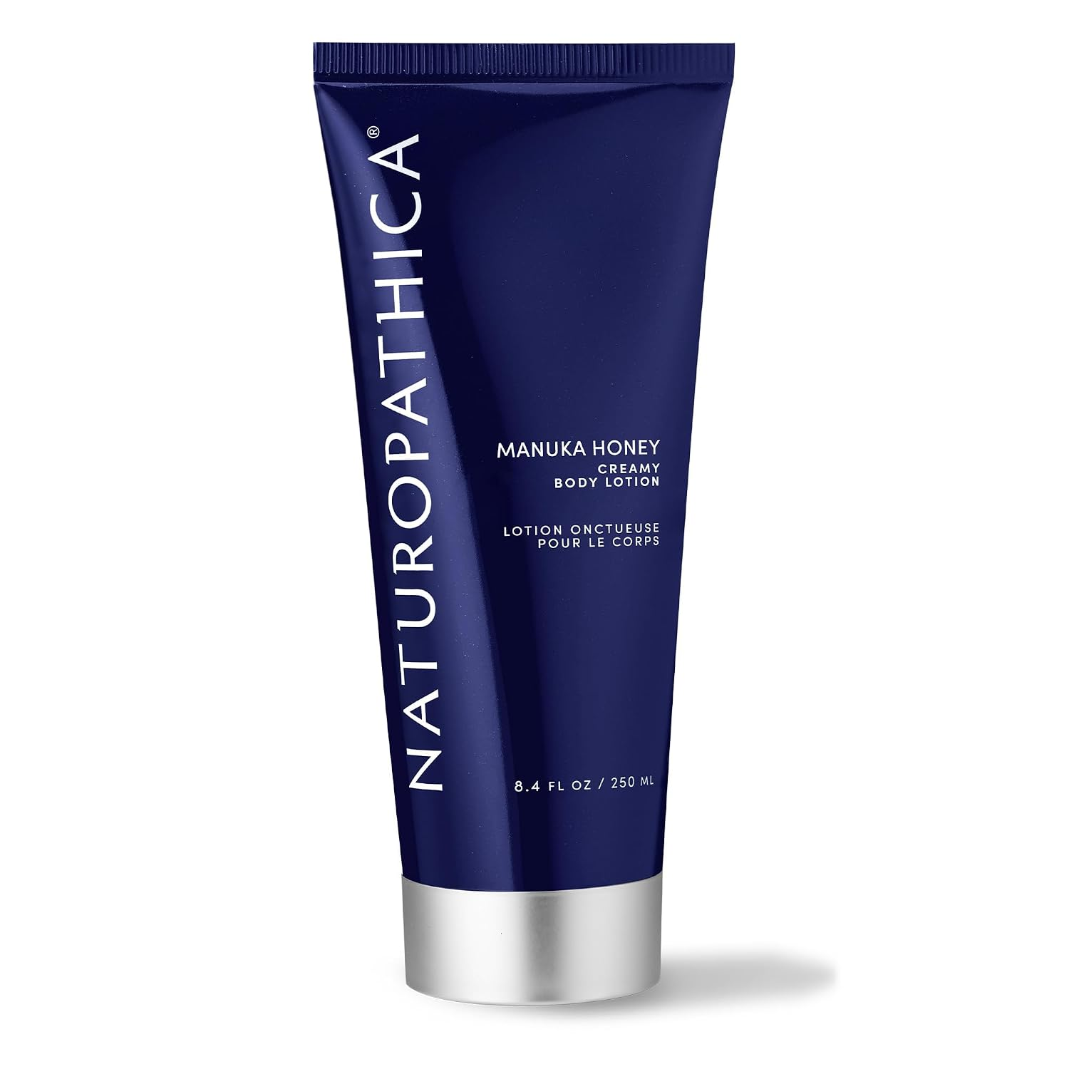 Naturopathica Manuka Honey Creamy Body Lotion tube on a white background