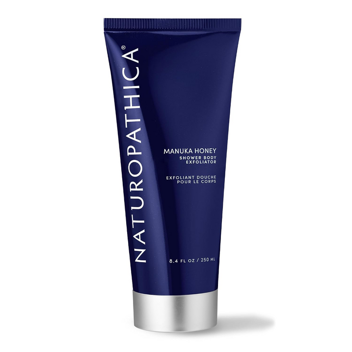 Naturopathica Manuka Honey Shower Body Exfoliator tube on a white background