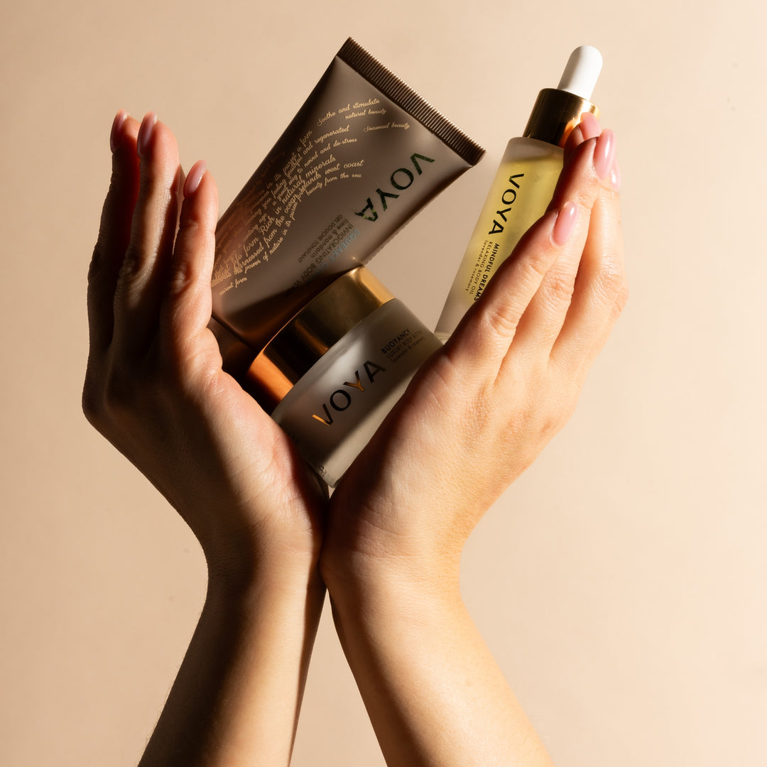Hands holding VOYA Body Discovery Set