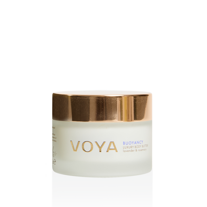 VOYA Buoyancy Luxury Body Butter mini jar in lavender and mint, featuring a frosted glass container and a metallic gold lid, set against a clean white background with a soft reflection.