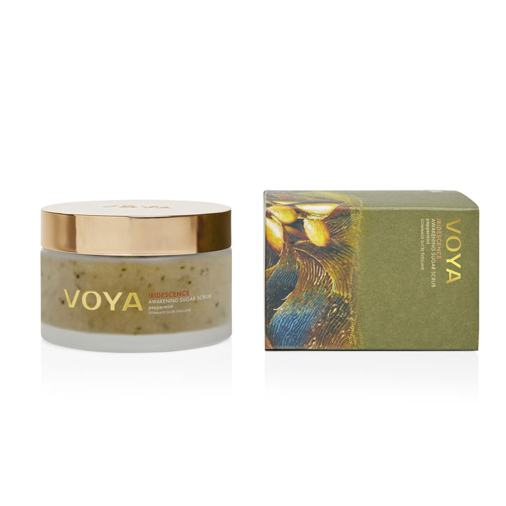 VOYA Iridescence Awakening Sugar Scrub jar beside its green illustrated box on a white background