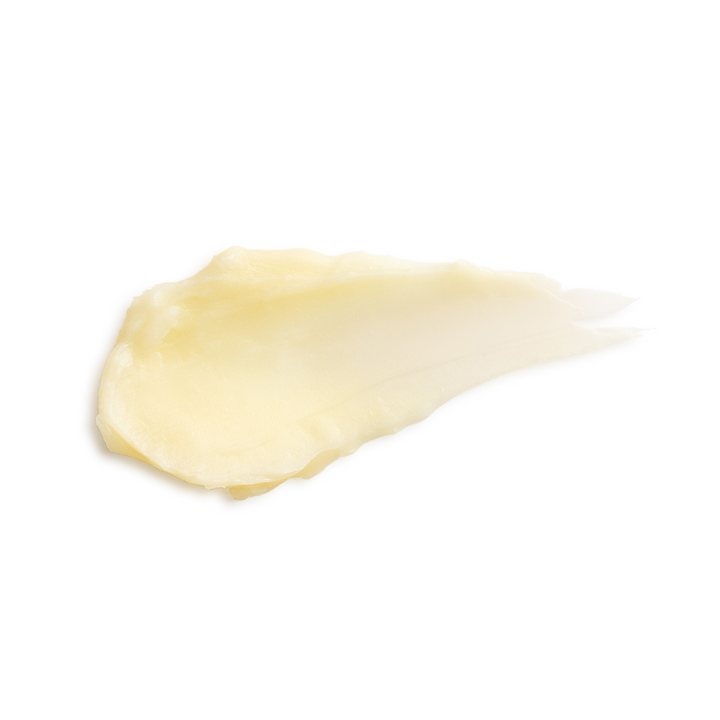 Close-up of Eminence Organics Citrus Lip Balm swatch on a white background
